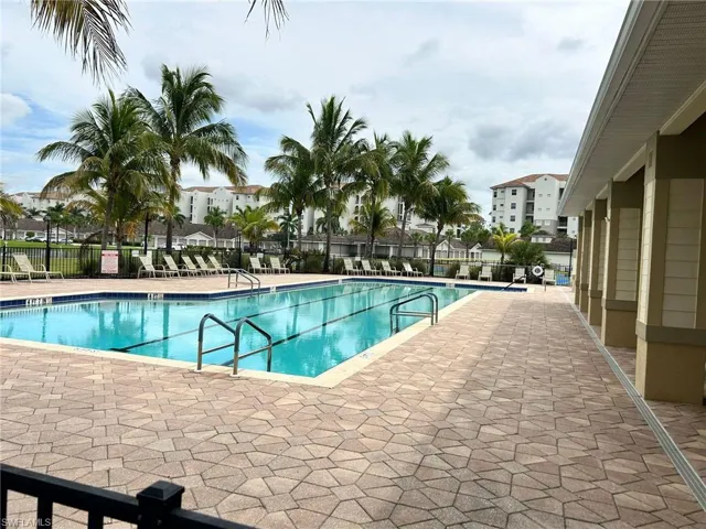 Community pool with a patio area