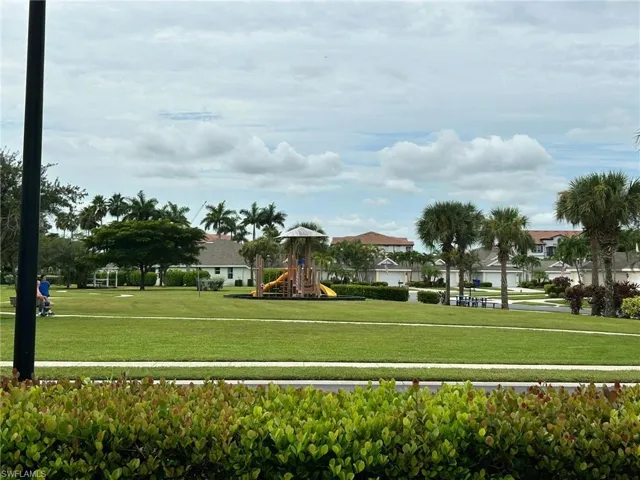 View of community featuring a lawn