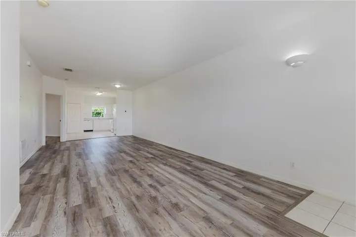 Unfurnished living room featuring light wood-type flooring