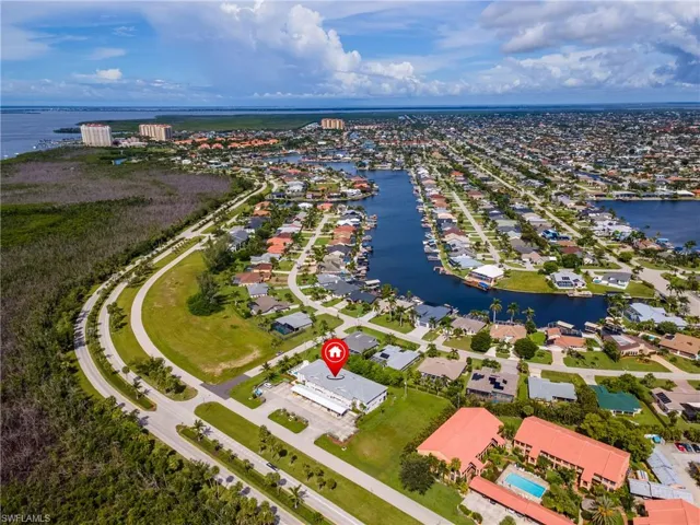 Aerial perspective of suburban area with a large body of water