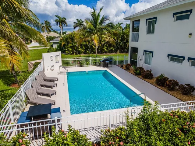 Community pool with a patio