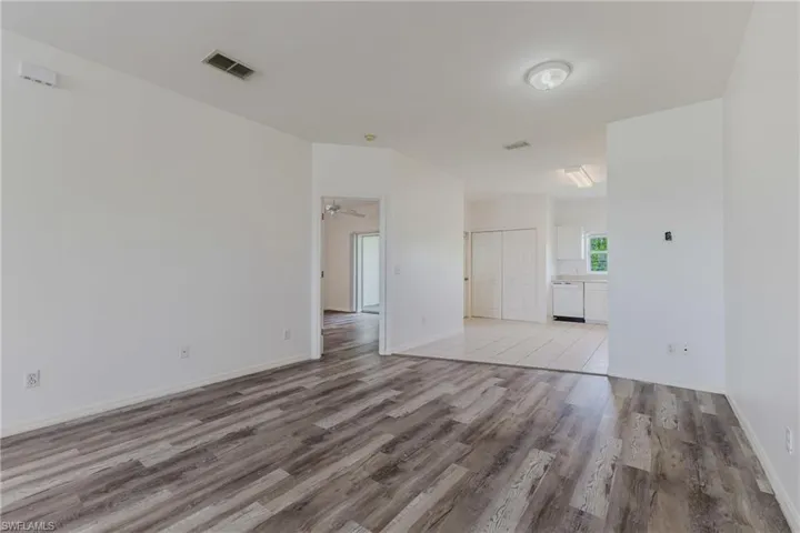 Spare room with light wood-type flooring and baseboards