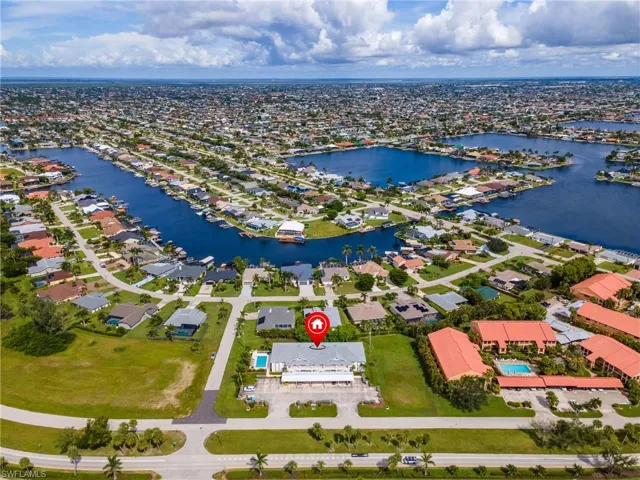 Aerial view of residential area featuring a large body of water