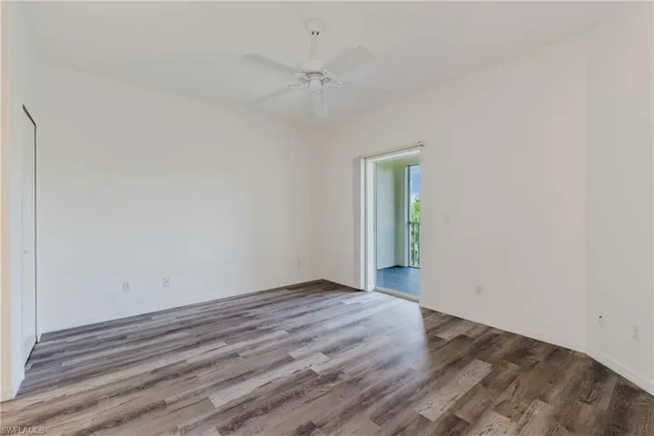 Spare room featuring wood finished floors and ceiling fan
