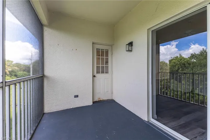 Balcony featuring a sunroom