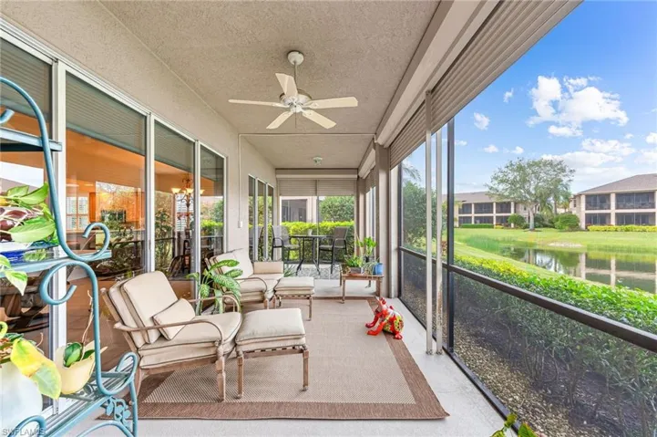 40' screened lanai featuring electric shutters and a water view
