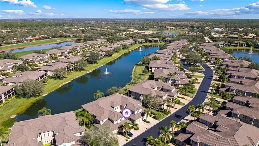 Aerial view of actual coach home waterfront location with multiple water features