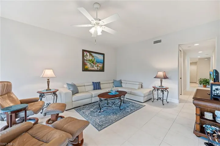 Tiled living room with ceiling fan