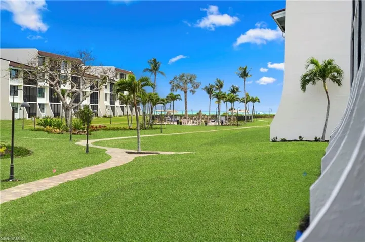 View of community featuring a lawn