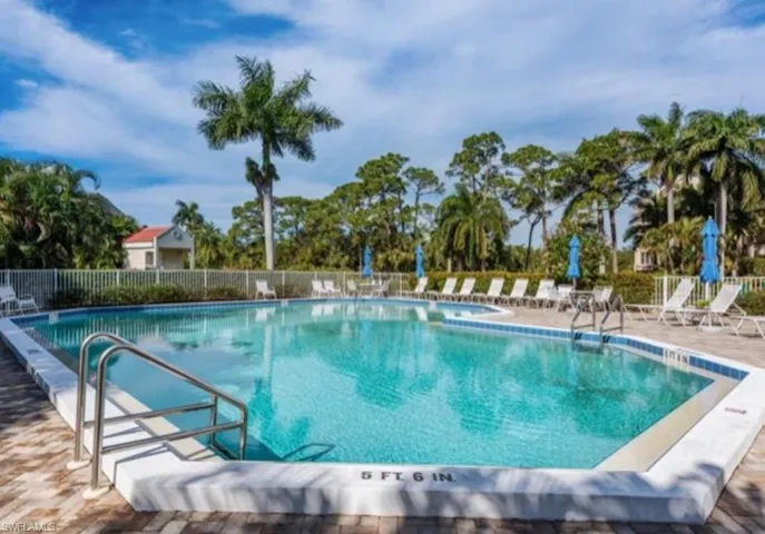 Community pool featuring a patio area
