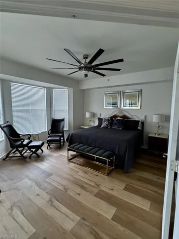 Bedroom featuring wood finished floors and ceiling fan