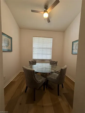 Dining space featuring wood finished floors and ceiling fan