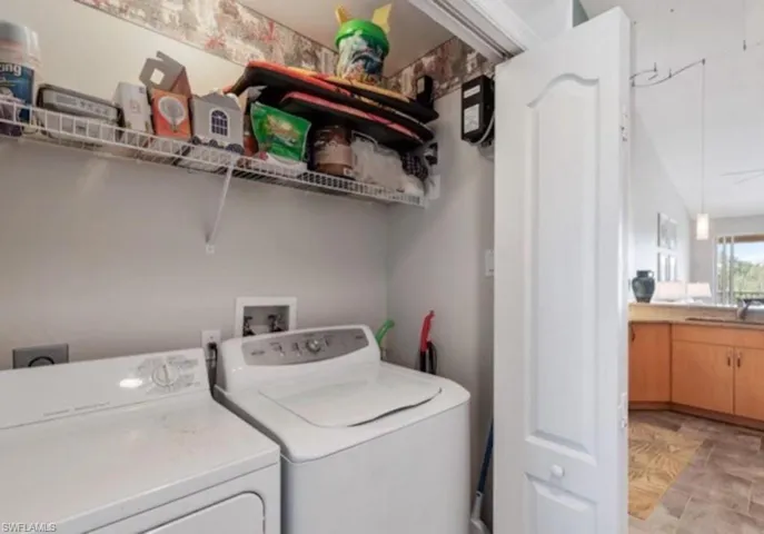 Washroom with washing machine and dryer