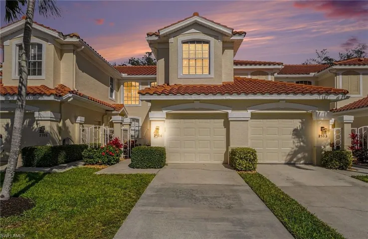 Mediterranean / spanish home with driveway, a tile roof, and stucco siding