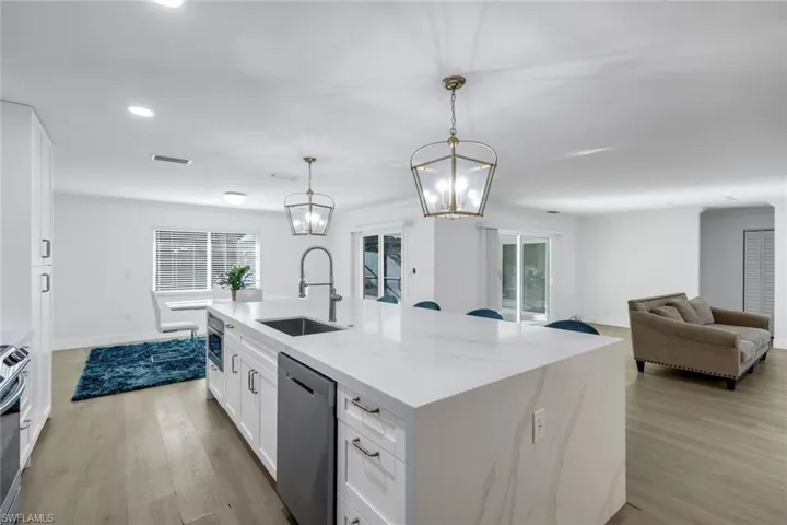 View of the kitchen and dining room from entryway.
