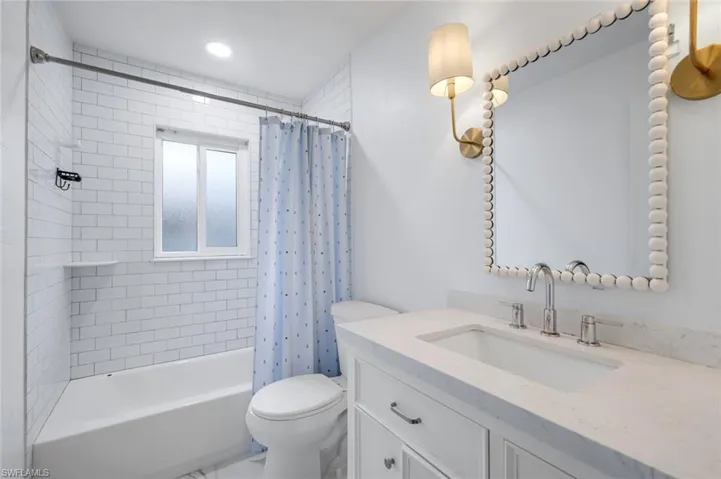 Guest bathroom features a shower and tub.