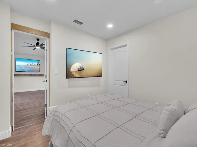 Bedroom featuring wood-type flooring