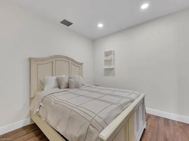 Bedroom featuring dark hardwood / wood-style flooring