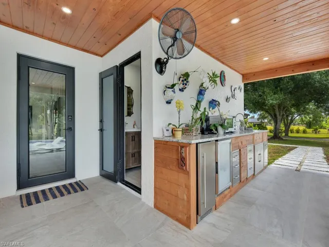 View of terrace featuring area for grilling