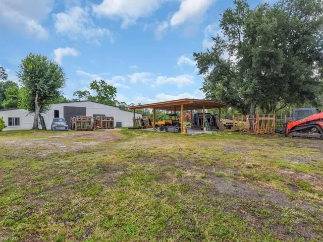 View of yard with an outdoor structure