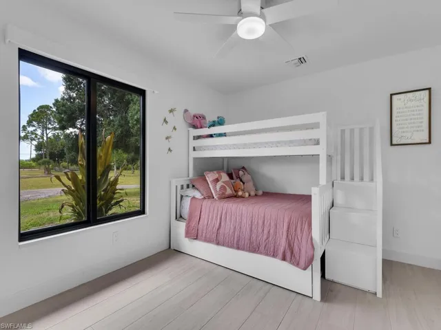 Bedroom with light wood-type flooring and ceiling fan