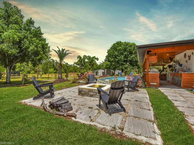 Patio terrace at dusk with a yard and sink