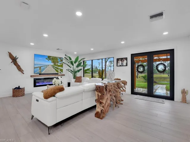 Living room featuring light hardwood / wood-style floors and french doors