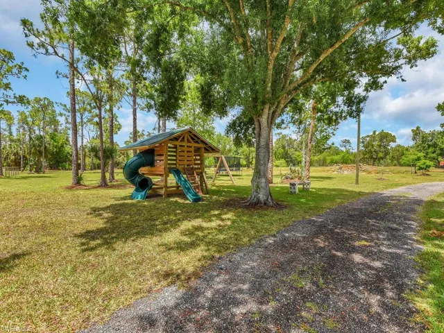 View of yard with a playground