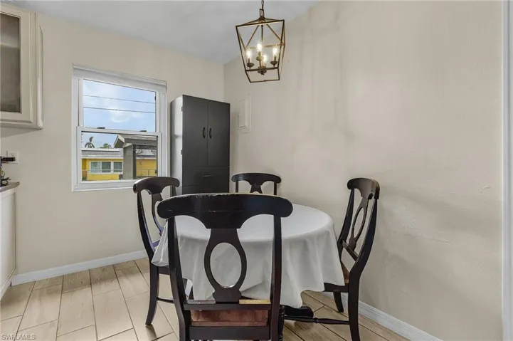 Dining space featuring a chandelier and light wood-type flooring