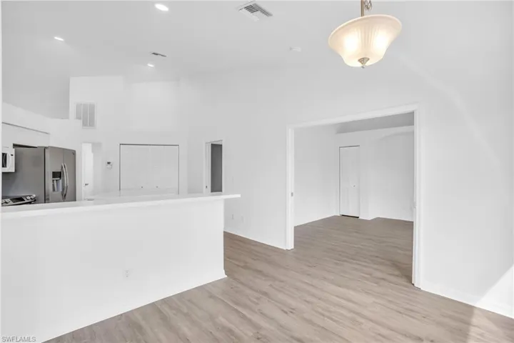 Empty room featuring light hardwood / wood-style flooring