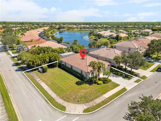 Aerial view of residential area with a large body of water