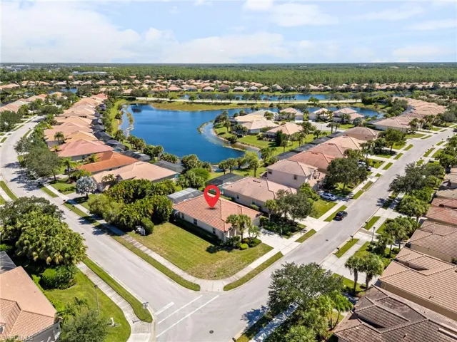 Aerial perspective of suburban area with a large body of water