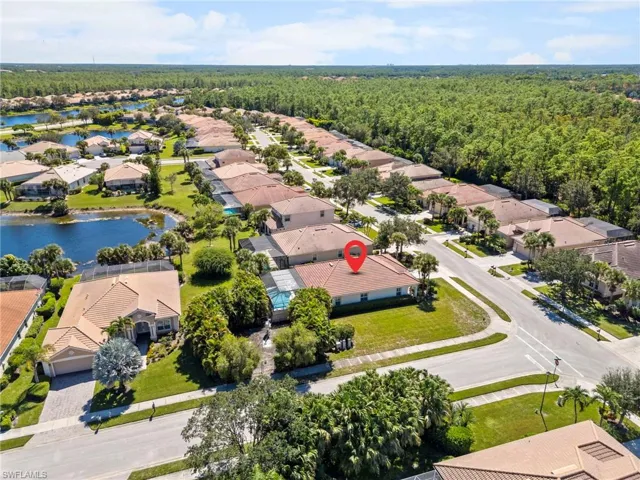 Aerial perspective of suburban area with a forest