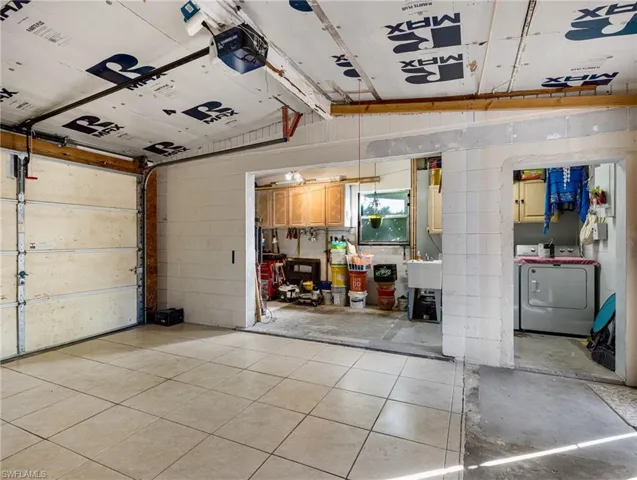 Garage with laundry room/storage area