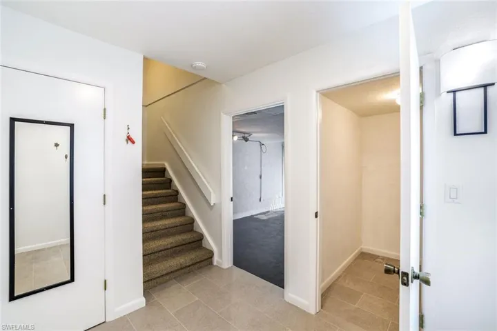 Inside Entry to Unit with storage and mud room