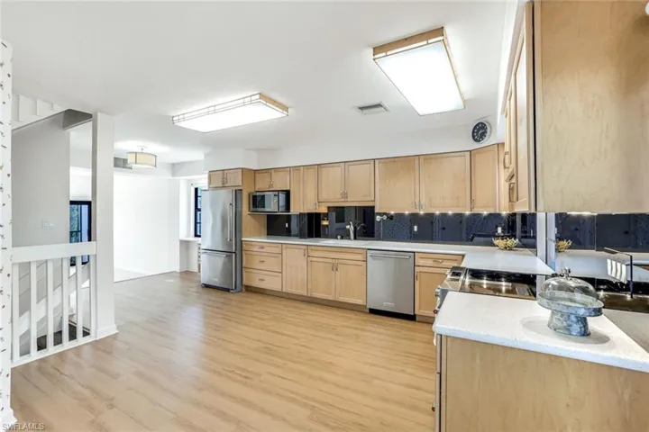 Large Kitchen with Wood cabinetry and SS Appliances
