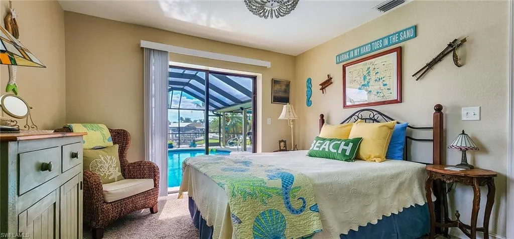 Carpeted bedroom featuring access to exterior