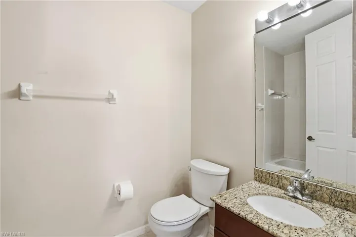 Bathroom with vanity and shower / tub combination