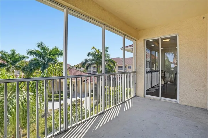 Balcony featuring a sunroom