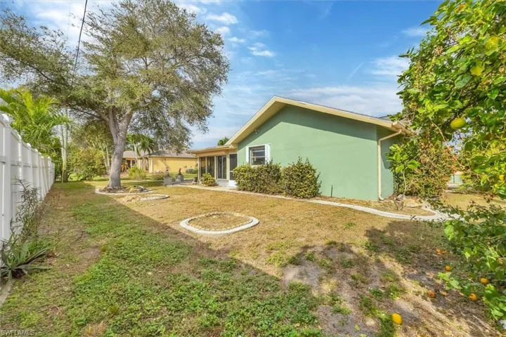 View of yard with a sunroom
