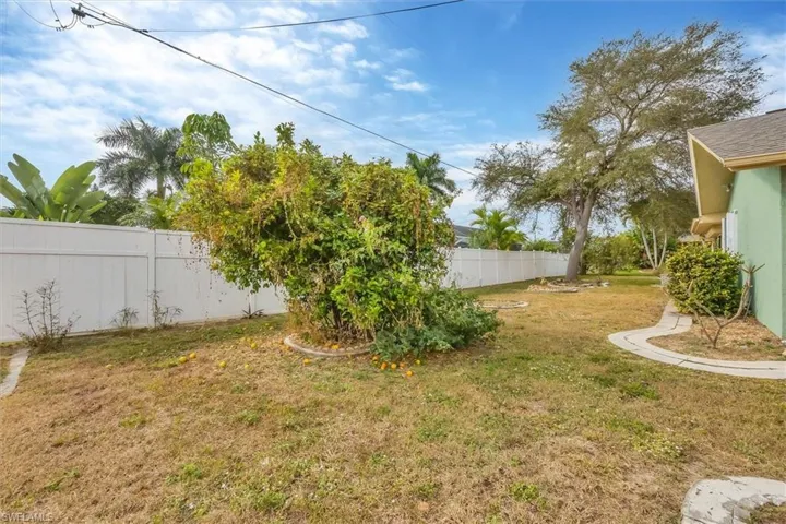 View of fenced backyard