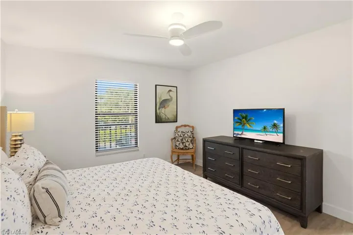 Bedroom featuring ceiling fan and light wood finished floors