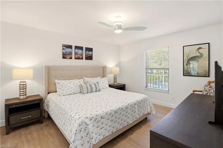 Bedroom with light wood-type flooring and ceiling fan