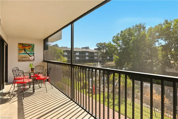 Balcony featuring a sunroom