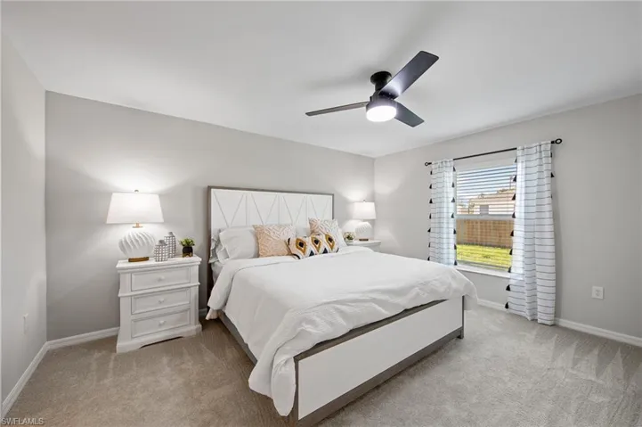 Bedroom featuring carpet floors and a ceiling fan