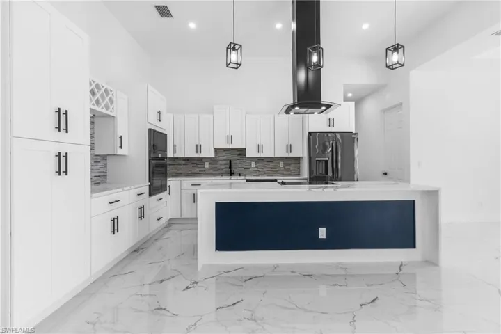 White Shaker Cabinets with Black Stainless Appliances