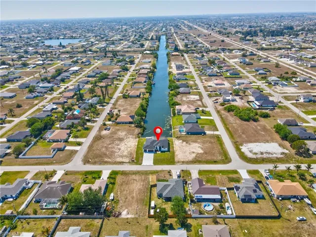 Aerial view with a water view and a residential view