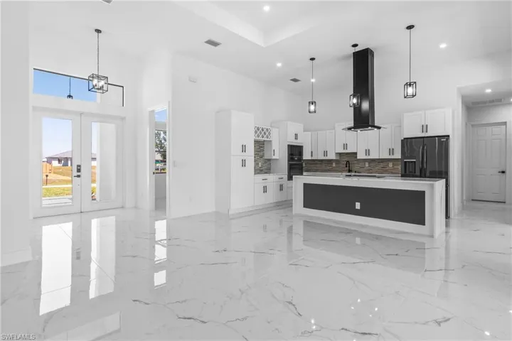 Chefs Dream Kitchen features a Custom Island with Waterfall
