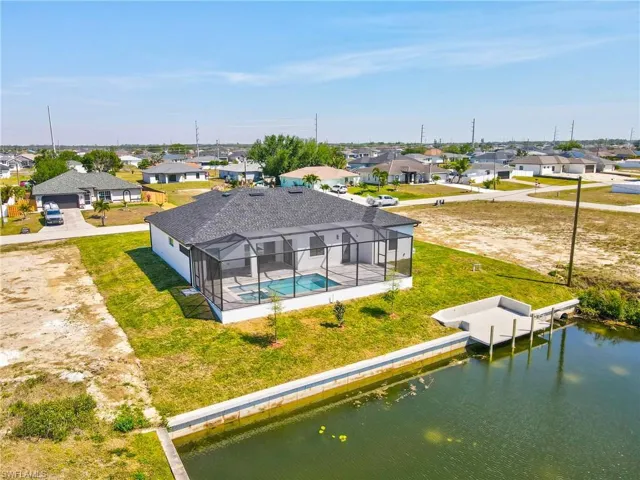 Drone / aerial view featuring a residential view and a water view
