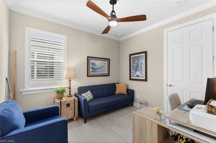 Office space featuring crown molding and ceiling fan